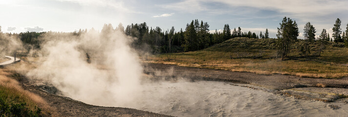 Wide shot of boiling mud caldron in yellowstone national park in america