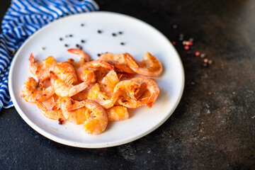 fried shrimps crustacean prawn seafood with spices ready to eat on the table for healthy meal snack outdoor top view copy space for text food background rustic image keto or paleo diet pescetarian