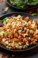 Roasted Cauliflower salad with chickpea, cucumber, greens and feta cheese. healthy food