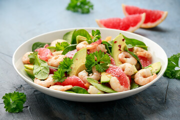 Fresh Avocado Grapefruit shrimp salad in white plate