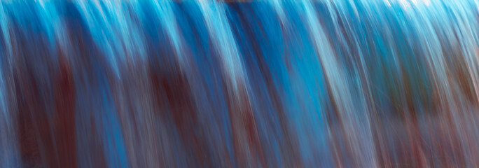 Long exposure photo of fountain stream with colorful reflection. colorful abstract photo of water,...