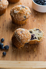 Blueberry muffins homemade with farm fresh organic blueberries. Traditional classic American bakery or pastry shop favorite. Muffins topped with sugar. Copy Space.
