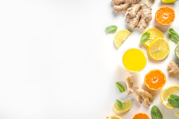 Immunity booster drink ingredients. Homemade ginger and citrus juice or cocktail, with fresh citrus...