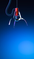 Machine Robotic Claw on Blue Gradient Background. Crane Game. Gambling. Happy Chance. 3d Rendering