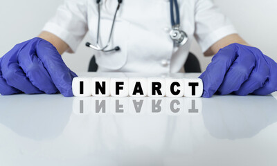 The doctor put together a word from cubes INFARCT