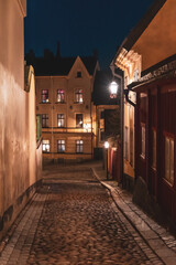 Evening street in Stockholm. Cozy winter atmosphere. Warm lighting
