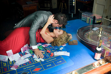 young couple in love on the casino table