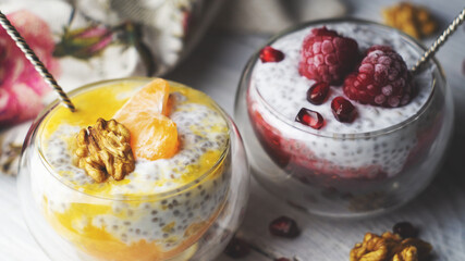 Chia pudding with tangerine, raspberries, pomegranate and nuts