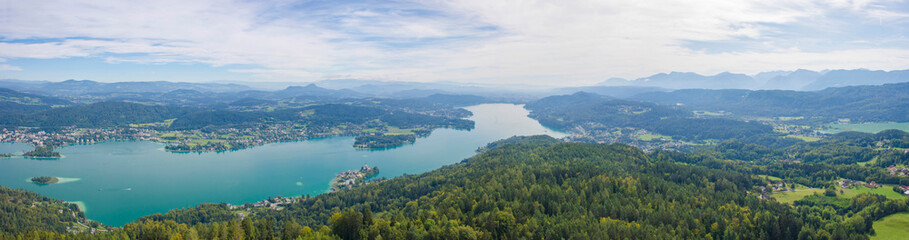 Fototapeta na wymiar Aerial view of the alpine lake Worthersee, famous tourist attraction for many water activity in Klagenfurt, Carinthia, Austria