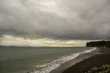 cloudy sea and great crag on the pacific coast, calderas, costa rica