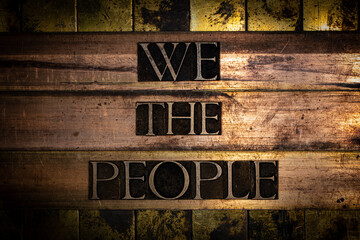 We The People text on vingtage bronze and copper background