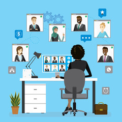 Group video conference, teamwork. African american business woman sitting at workplace, rear view. Remote negotiations,