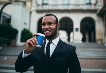 Businessman with coffee around town