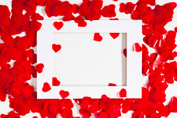 Creative Valentine's Day concept. valentines, red hearts confetti on white background. Flat lay, top view, copy space