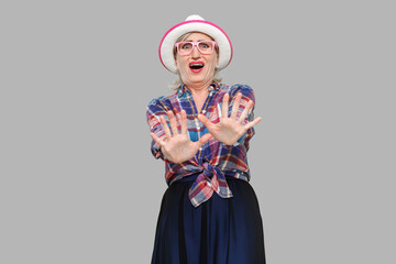 Please stop, i don't need this. Portrait of scared modern stylish mature woman in casual style with...