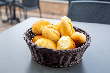 Bread basket in the restaurant. Spiced buns are in the basket