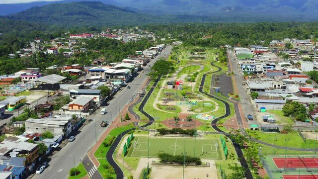 Aerial view of a large park within a city with roads ath both sides