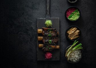 Braise beef short ribs, asian style with rice and radish, dark photo, copy space - 404335734