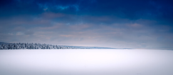 Winter scenic snowy cloudy landscape, forest, snow. Vysocina region,Czech Republic,Europe.  .