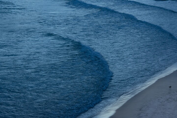 Waves Cascading on the Beach at Dusk