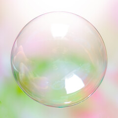Soap ball in daylight against a background of greenery