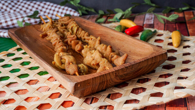 selective focus - sate usus or chiken intestines satay. traditional Indonesian street food