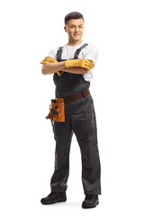 Full length portrait of a young male worker in a uniform with a tool belt