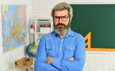 Fototapeta premium Checking the results. man engineering graphics and projects. science in modern school. Math is favorite subject. study algebra in college. formal sciences. mature teacher in glasses. back to school