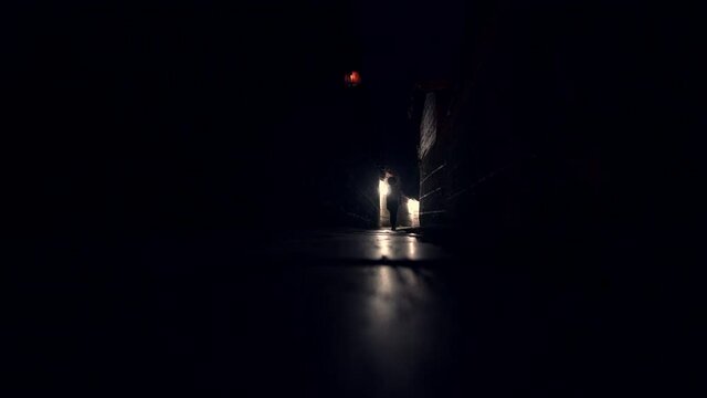 Girl walking empty dark alley during night