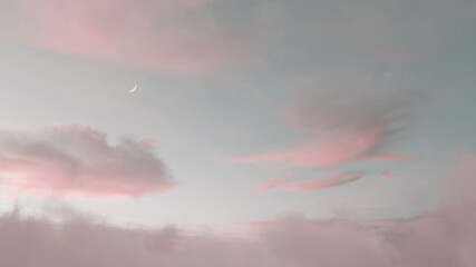 view to soft purple sky with fluffy clouds and crescent moon