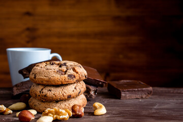 Organic food snack tasty sweet dessert milk dark chocolate chip salt cookie closeup piece fruit orange raspberry hazelnut nuts cinnamon on cocoa cacao powder wooden table for new year Christmas gift