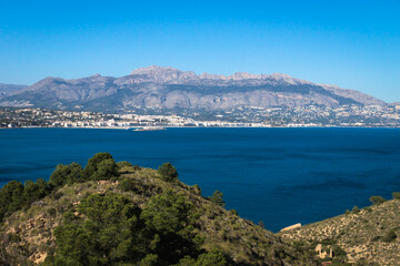 Natural park 'Serry Gelada' with view to Altea under mountainrange and ruin of ocher mine along the coast of Albir, Spain
