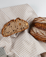 Fresh loaves of bread on a white table