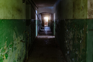Dark dirty corridor of old abandoned building