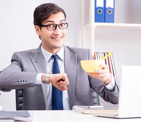 Businessman looking after newborn baby in office