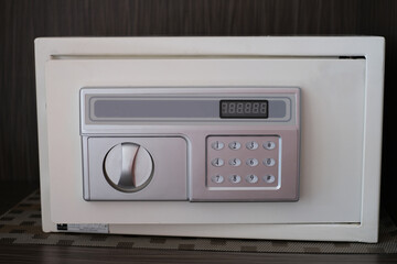 Small white digital safe for home or office. Selected focus.