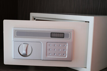 Small white digital safe for home or office. Selected focus.