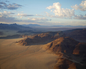 view from hot air balloon over red dunes of Namibia hot air ballooning on African holiday view from above 