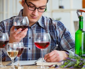 The professional sommelier tasting red wine