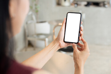 cell phone blank white screen mockup.woman hand holding texting using mobile on desk at office.background empty space for advertise.work people contact marketing business,technology
