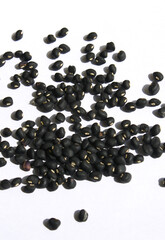 Black beans on white background.
