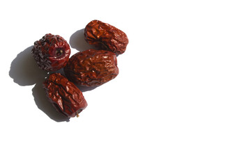 close up Red dates on white background.