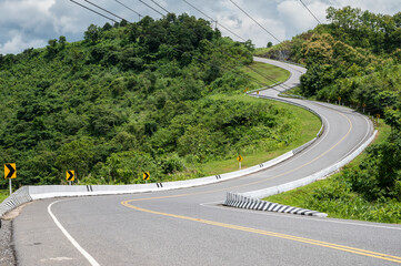 Beautiful steep curved road (look like number 3) on the high mountain in Nan province, Thailand. An...
