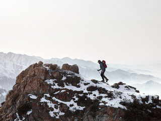 Hiker walking at beautiful mountain landscape