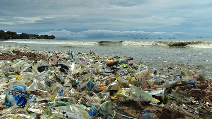 4K video of plastic garbage and other trash on sea beach. Ecological concept