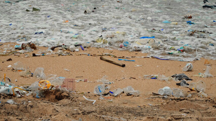 4K video of plastic garbage and other trash on sea beach. Ecological concept