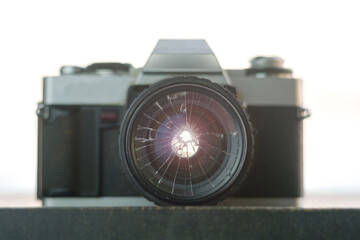 broken lens on the old vintage film camera, selective focus