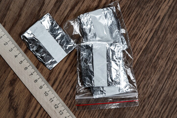 evidence of smuggling traffic: packaging of an unknown drug next to the forensic scale