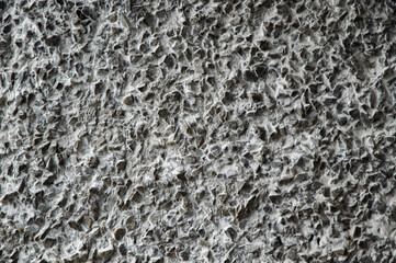 decorative coating with fine stone abrasive, dark background
