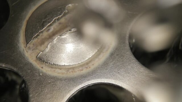 Water flowing down the drain, macro shot with prob lens